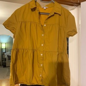 Yellow peplum button shirt.